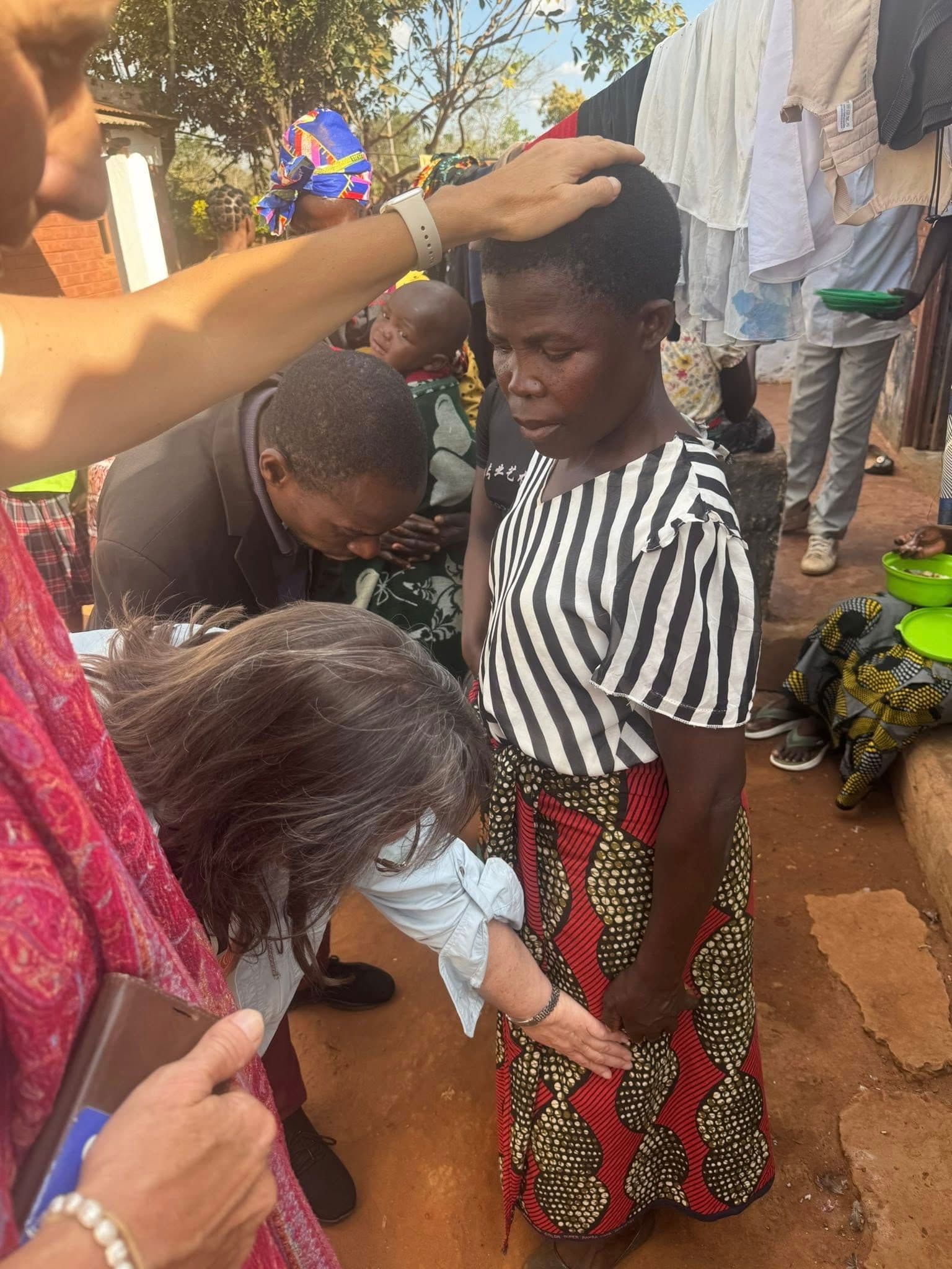 Outdoor prayer and laying hands