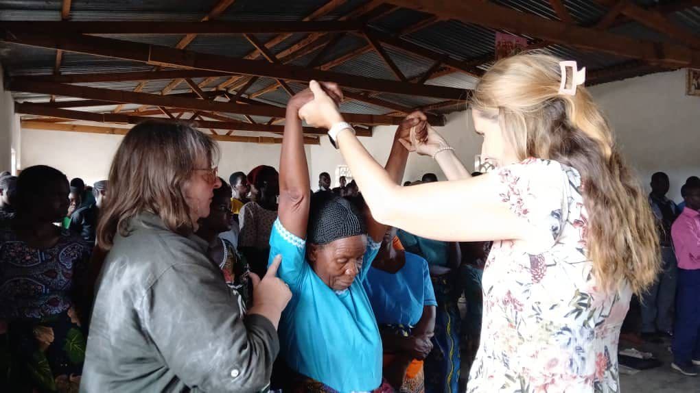 Women praying together in church